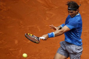 Nadal of Spain returns a forehand to Monaco of Argentina during their match at Madrid Open tennis tournament in Madrid
